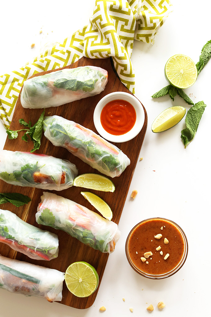 Cutting board with Vietnamese Vegan Spring Rolls made with Crispy Almond Tofu