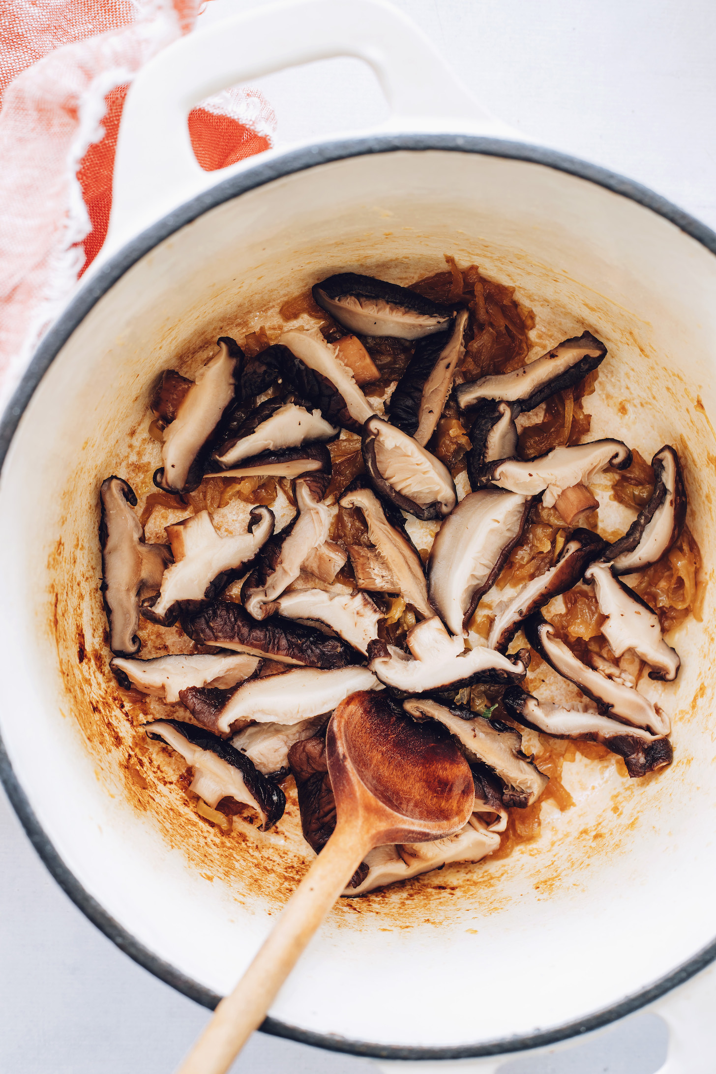 Sautéing mushrooms and caramelized onions in a Dutch oven
