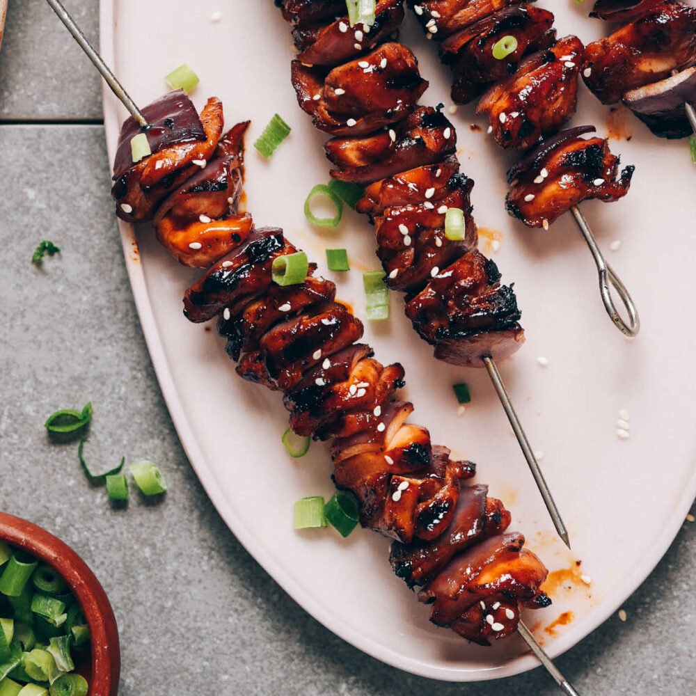 Plate of grilled teriyaki chicken skewers
