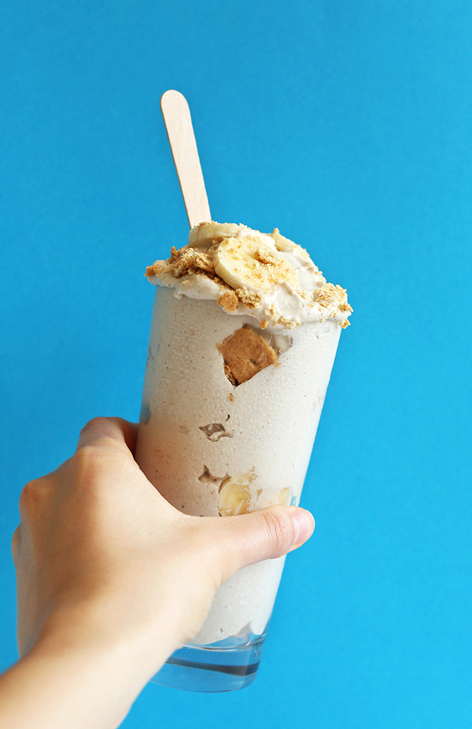 Holding up a homemade Creamy Vegan Banana Cream Pie Blizzard