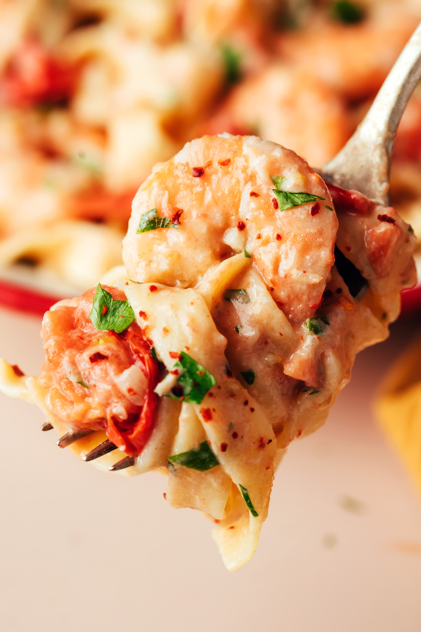 Fork with a close up bite shot of pasta swirled on a fork with shrimp
