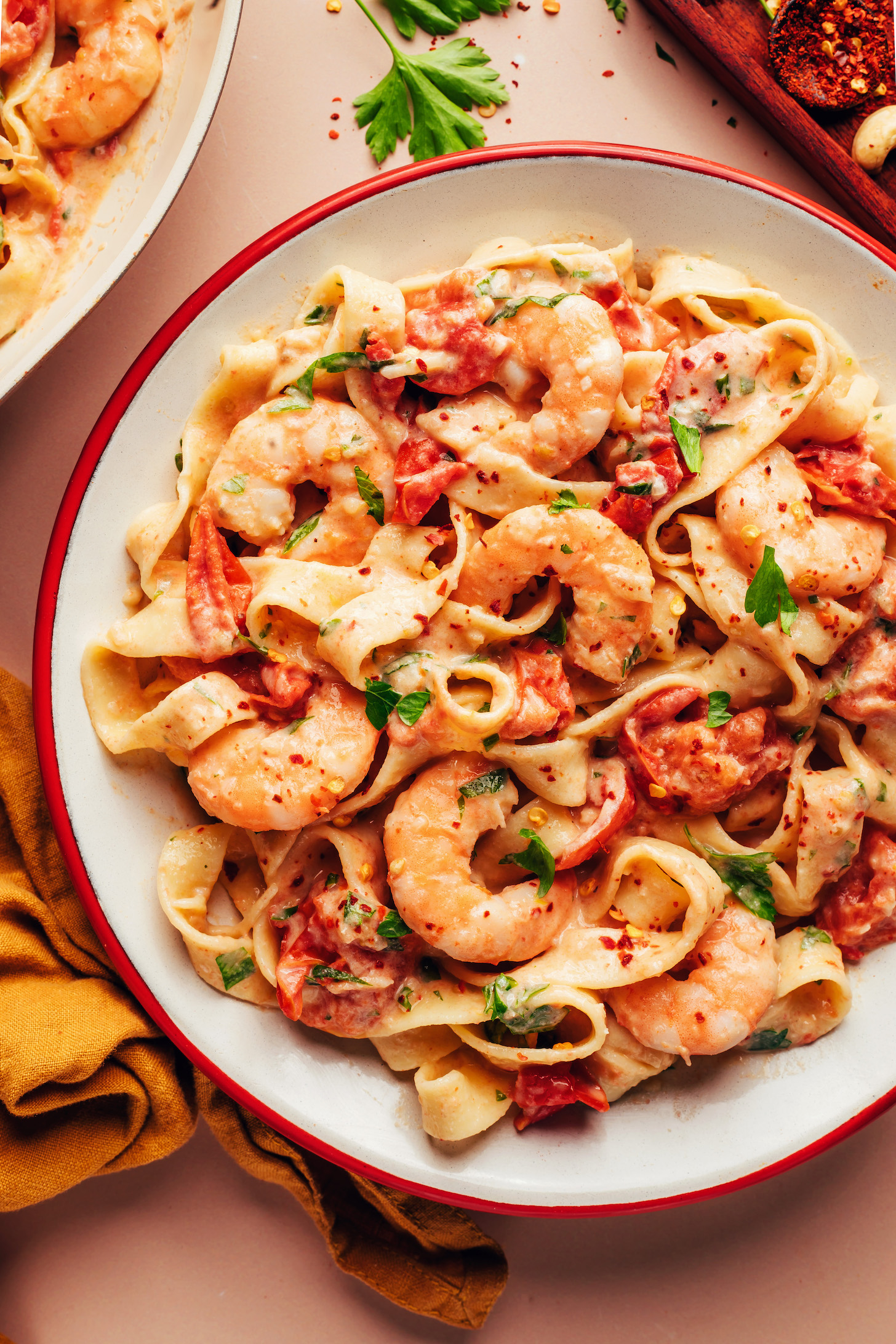 Large serving dish of our creamy dairy-free Tuscan shrimp pasta