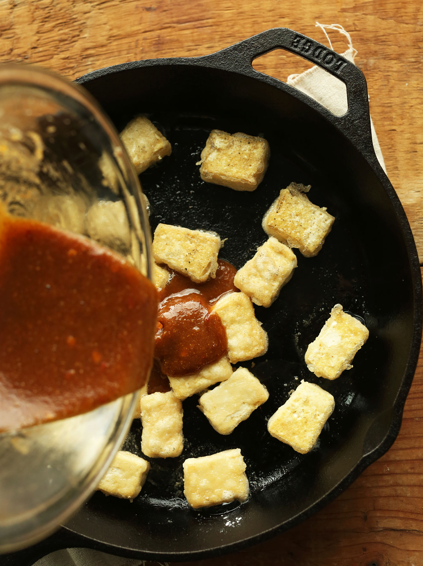 Making Almond Butter Tofu in a cast-iron skillet