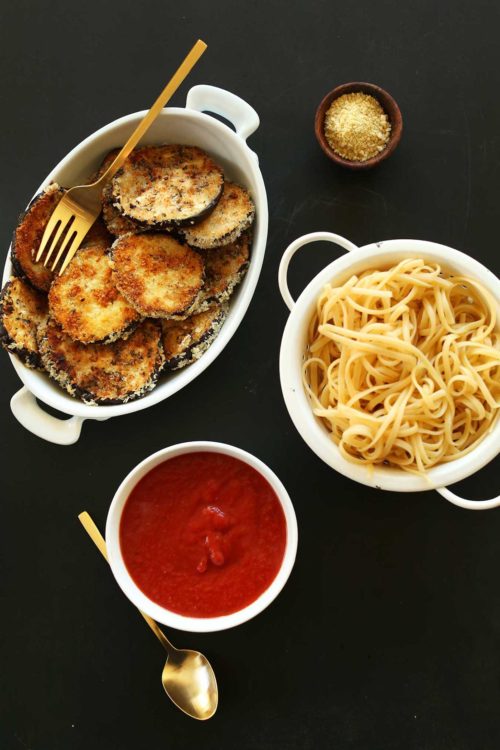 Vegan Eggplant Parmesan with marinara and pasta for serving