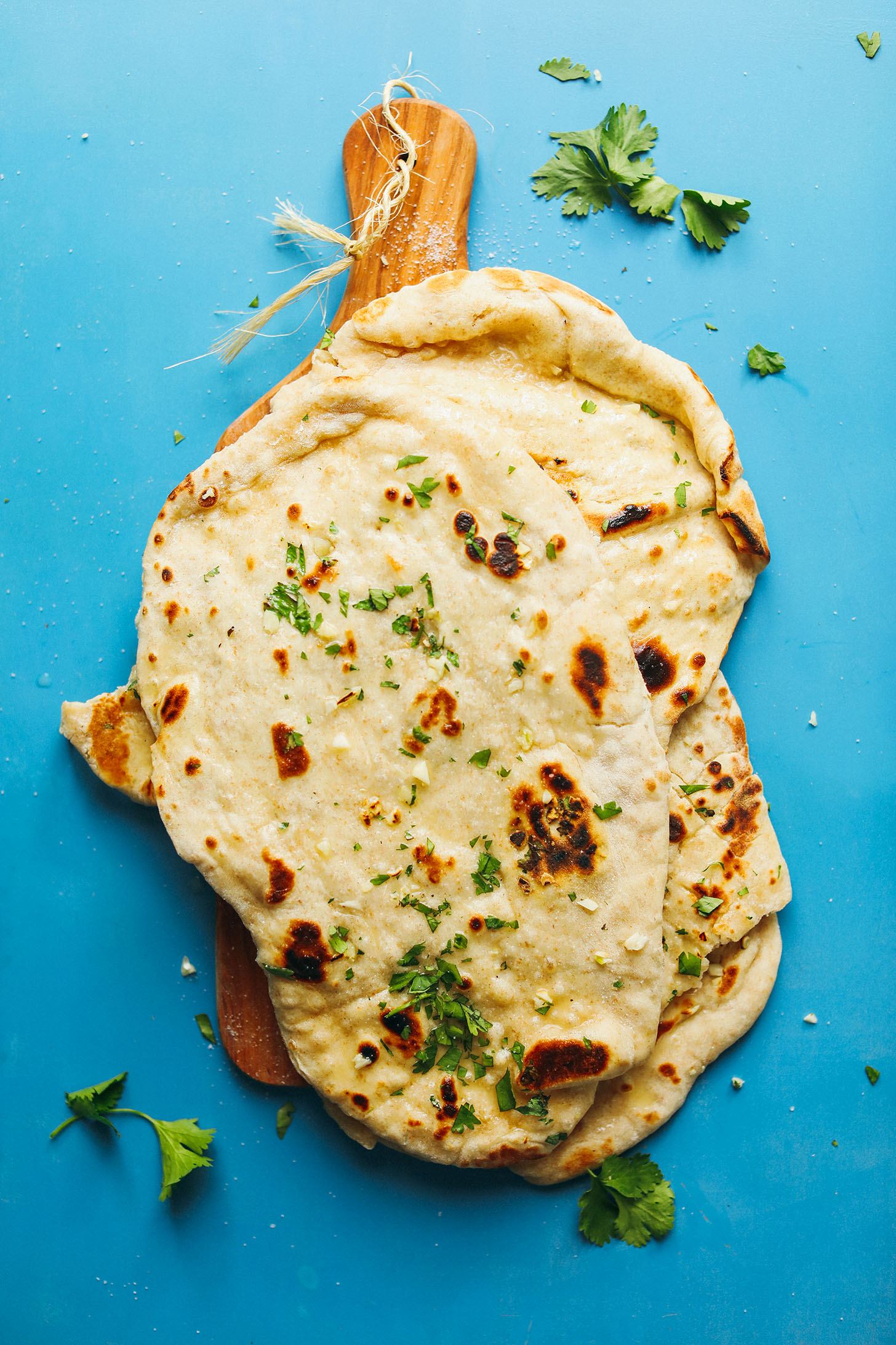 Stack of perfect vegan Naan on a wood cutting board