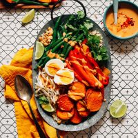 Tray filled with Gado Gado made with roasted and fresh vegetables and Spicy Peanut Sauce