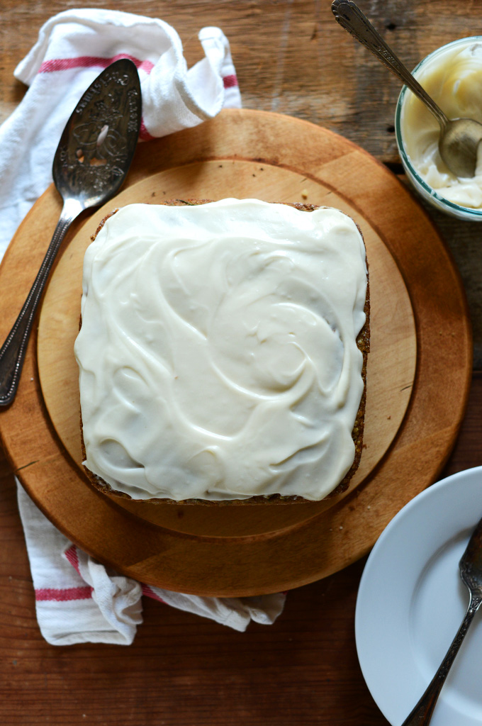 Cutting board with a loaf of Gluten-Free and Dairy-Free Zucchini Cake
