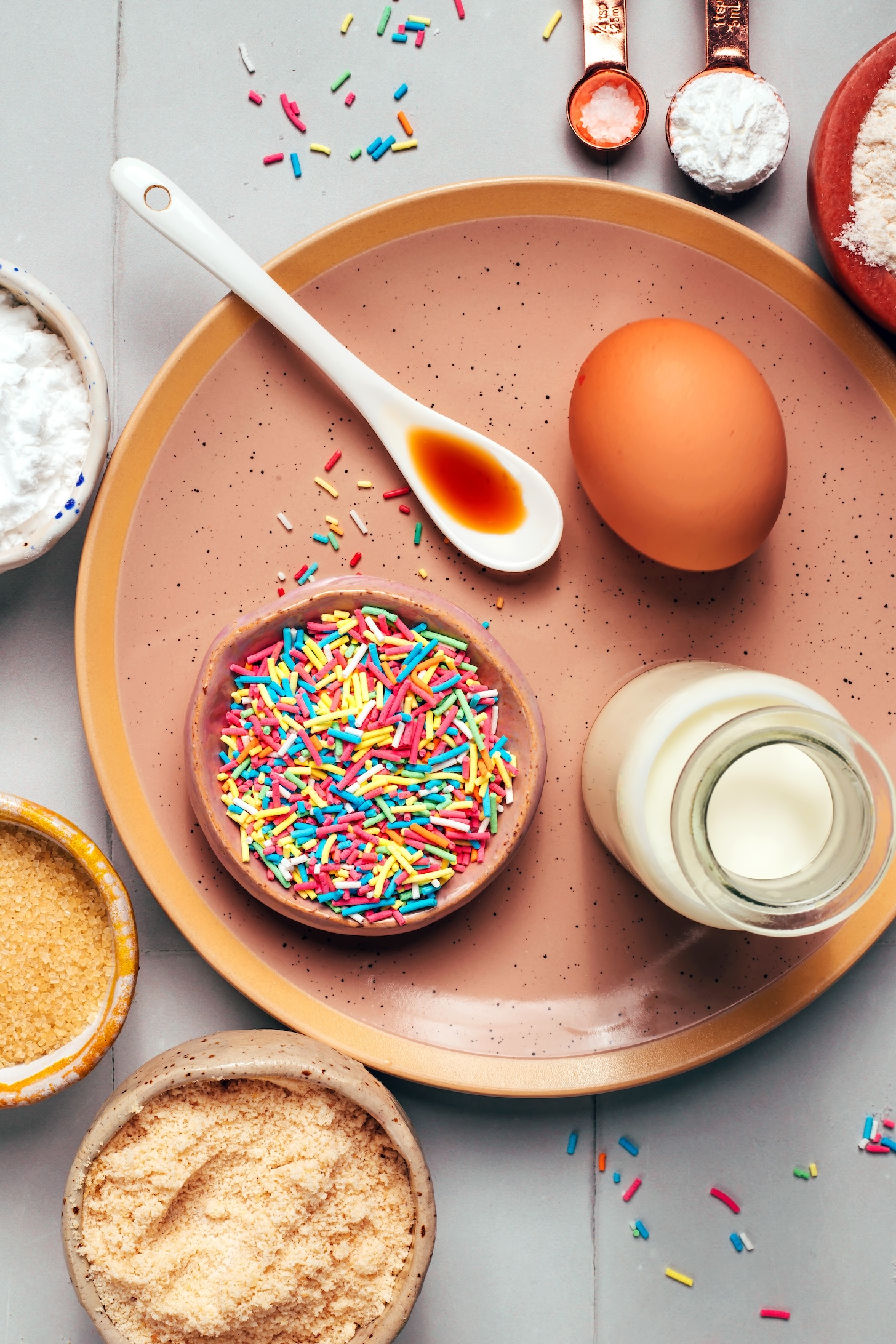 Egg, vanilla, rainbow sprinkles, dairy-free milk, almond flour, cane sugar, potato starch, sea salt, baking powder, and brown rice flour