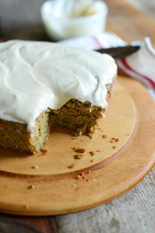 Loaf of Gluten-Free Zucchini Cake resting on a cutting board