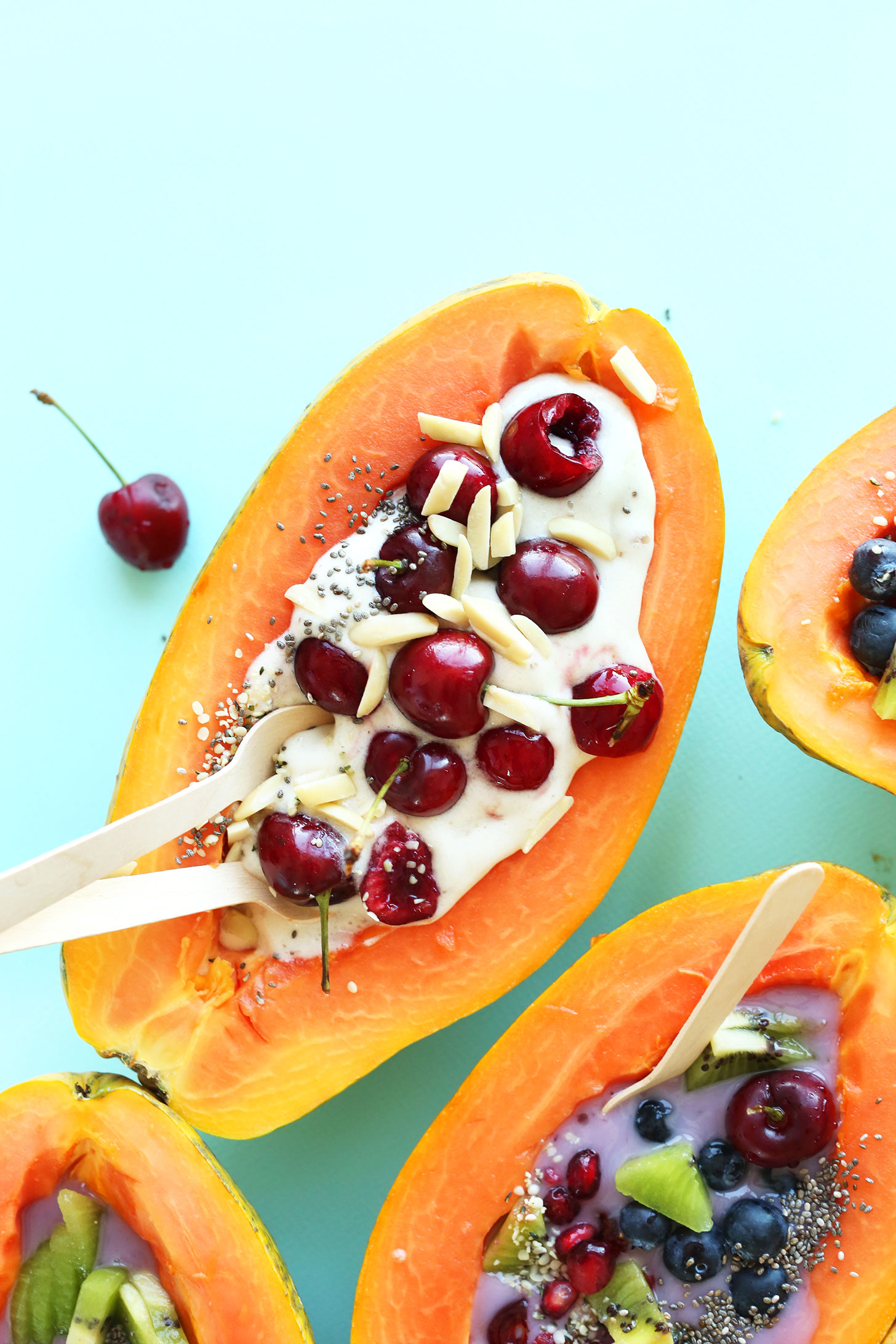 Fresh Papaya Boats loaded with toppings for a healthy summer breakfast