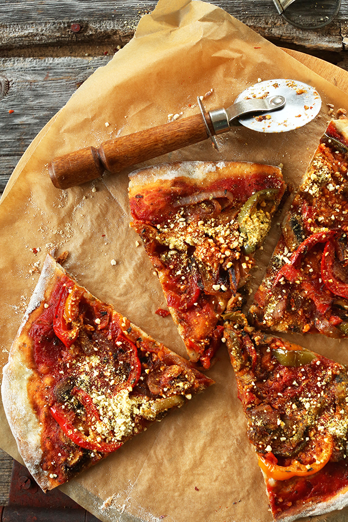 Parchment paper topped with slices of the Best Vegan Pizza
