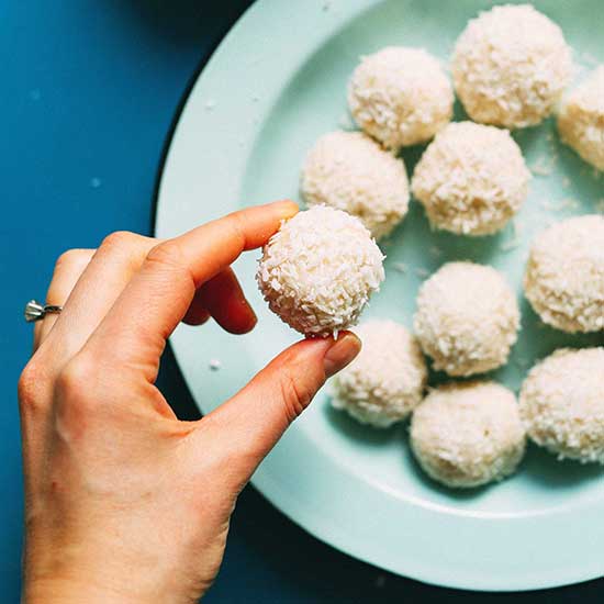 Holding up a White Chocolate Truffle above a plate of more truffles